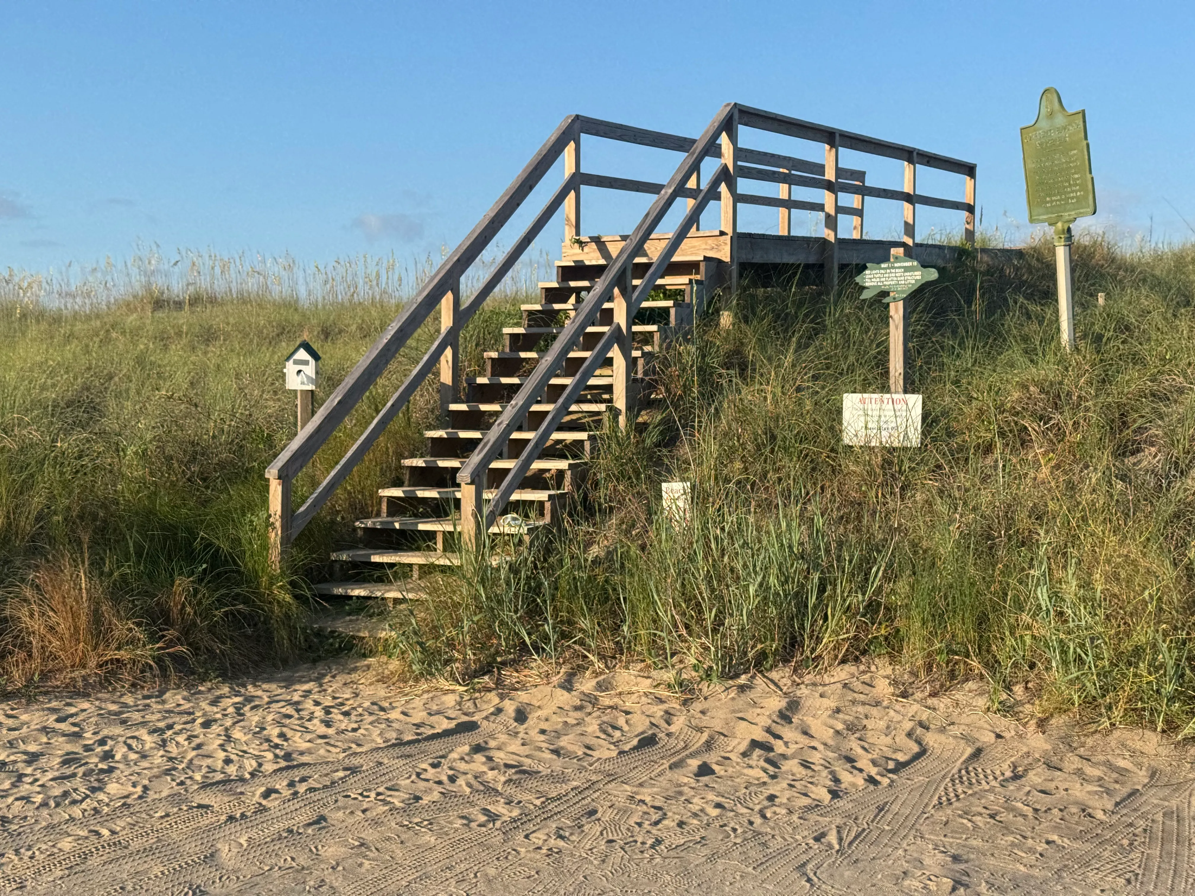 Wooden dune stairs and a walkway platform over the sea grass at Access 13