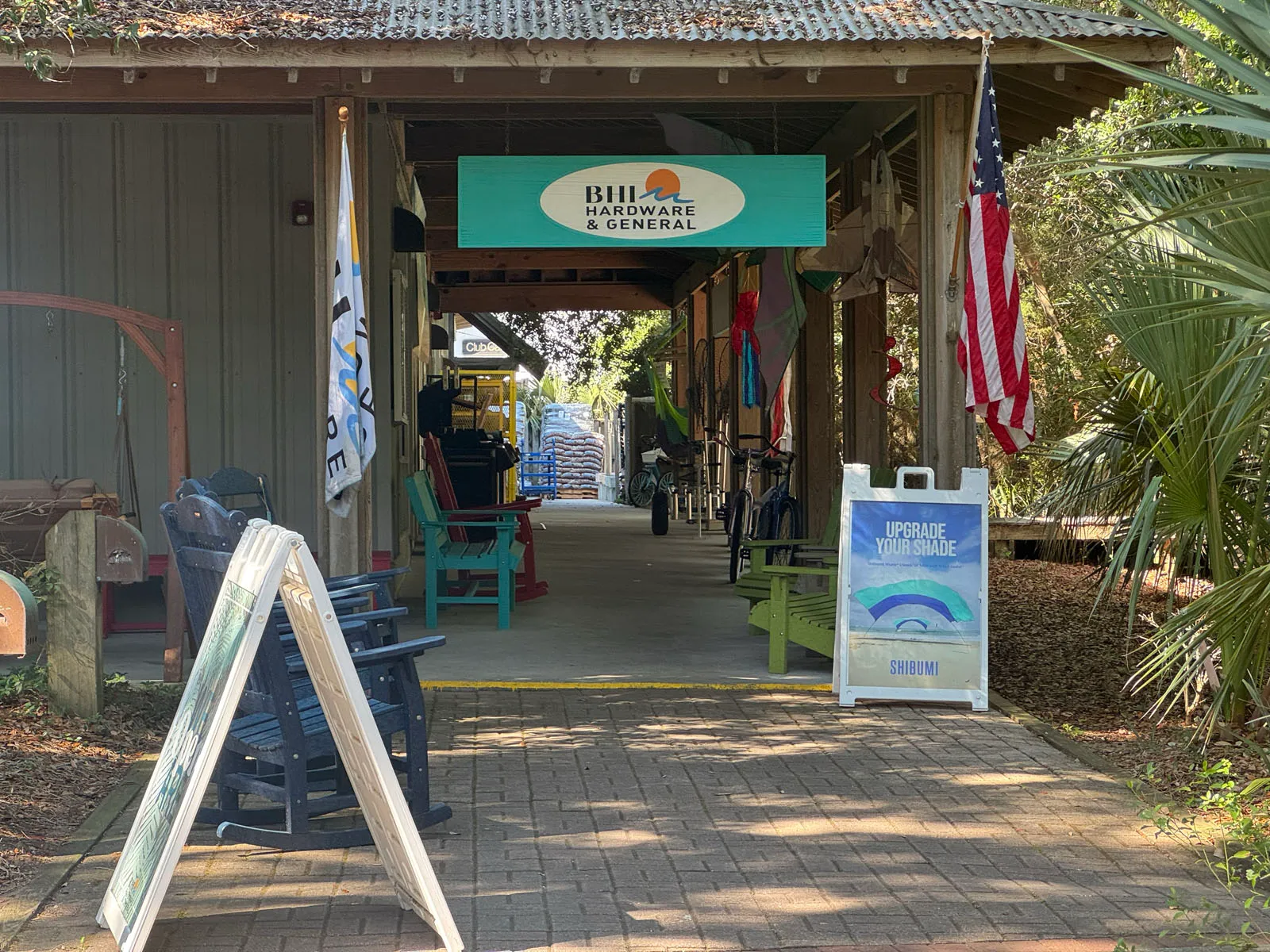 BHI Hardware & General breezeway with rockers and flag