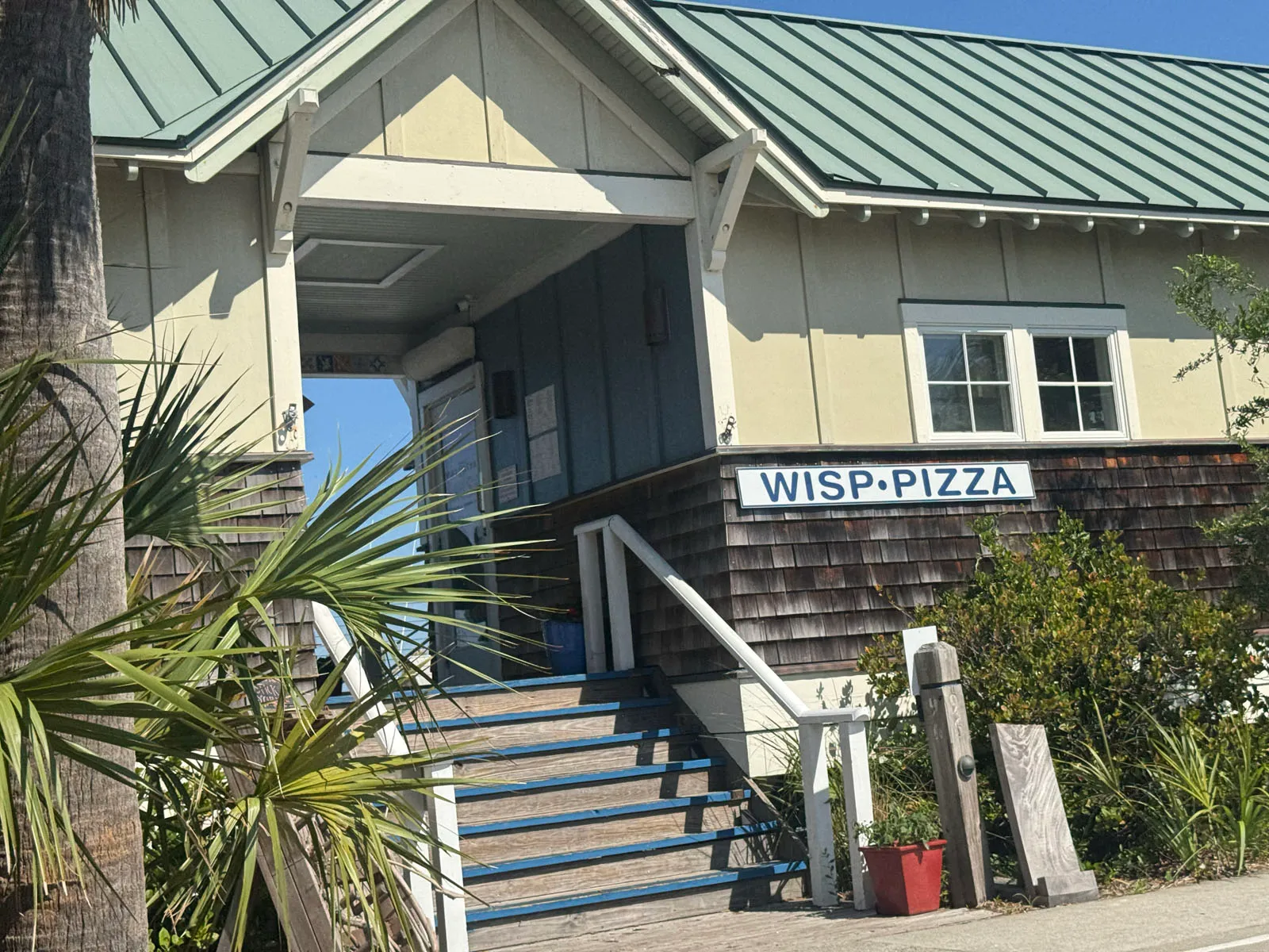Entrance and steps of Wisp Pizza restaurant building