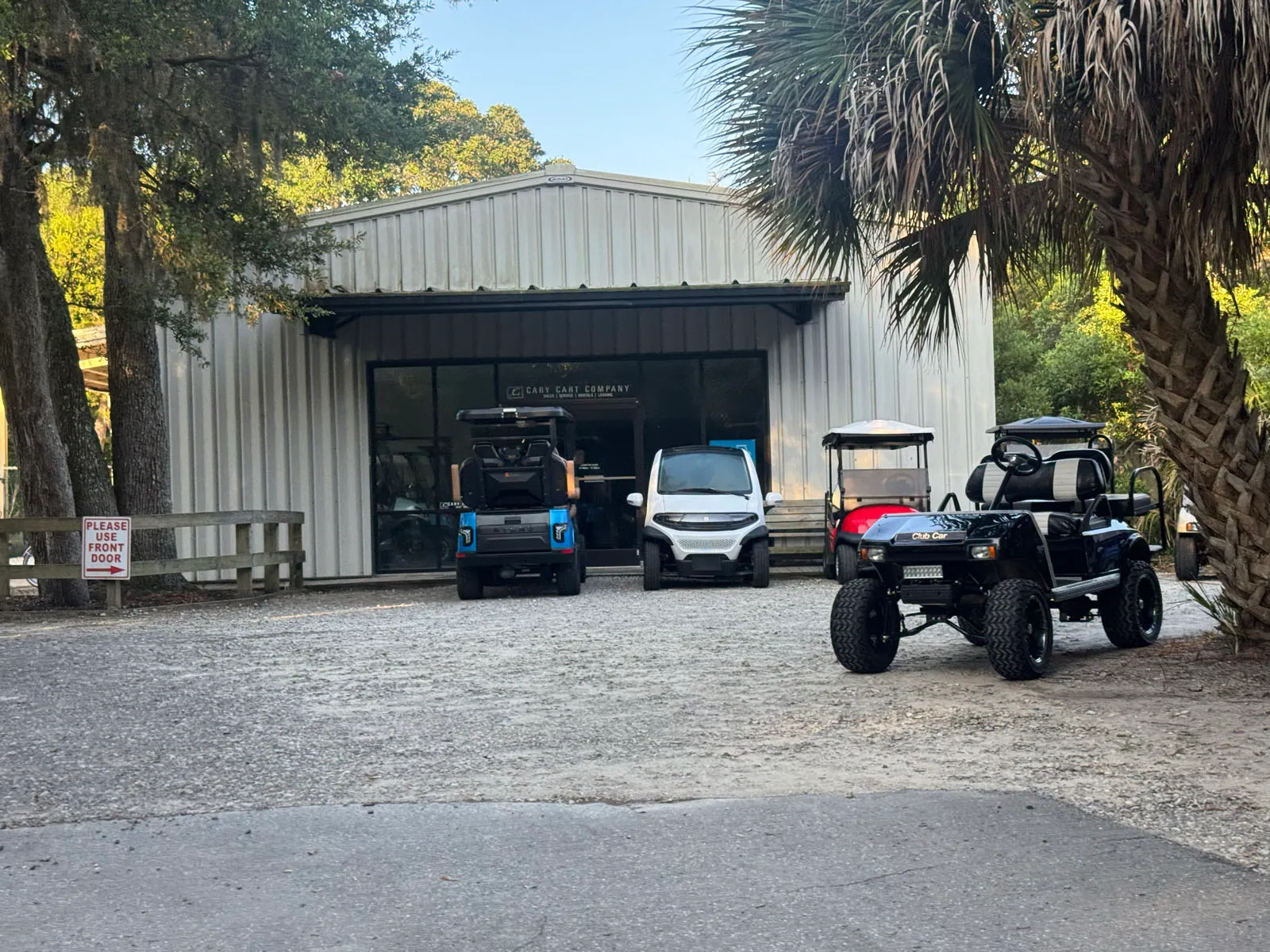 Easy Cart Company storefront with custom golf carts out front