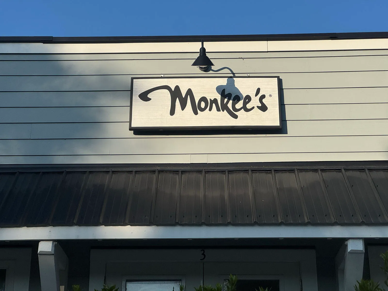 Monkee's boutique storefront sign, entrance number 3