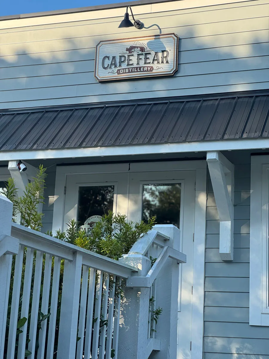 Cape Fear Distillery entrance porch and door below sign