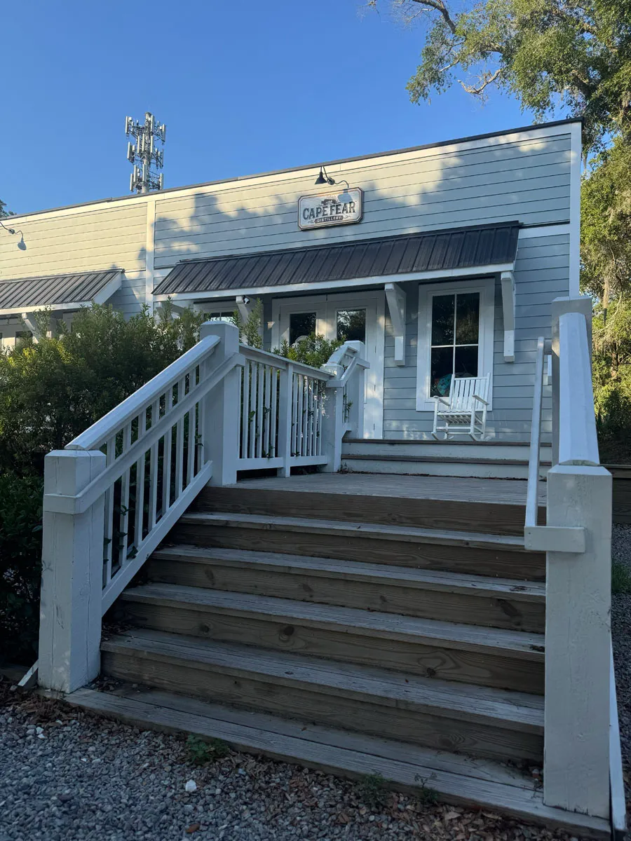 Cape Fear Distillery full facade with staircase and rocker