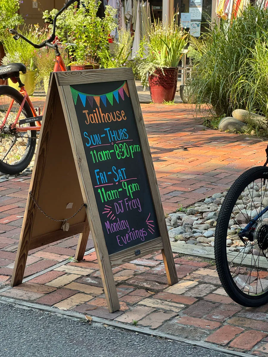 Jailhouse restaurant chalkboard hours sandwich board