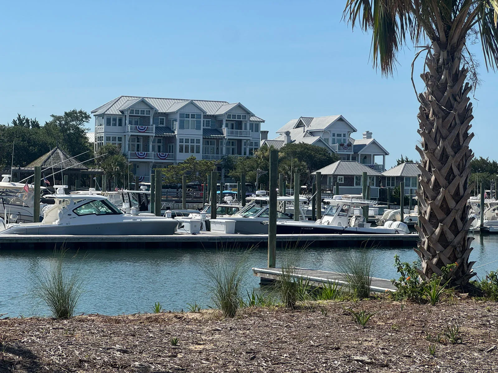 Marina basin with center-console boats and harbour condos