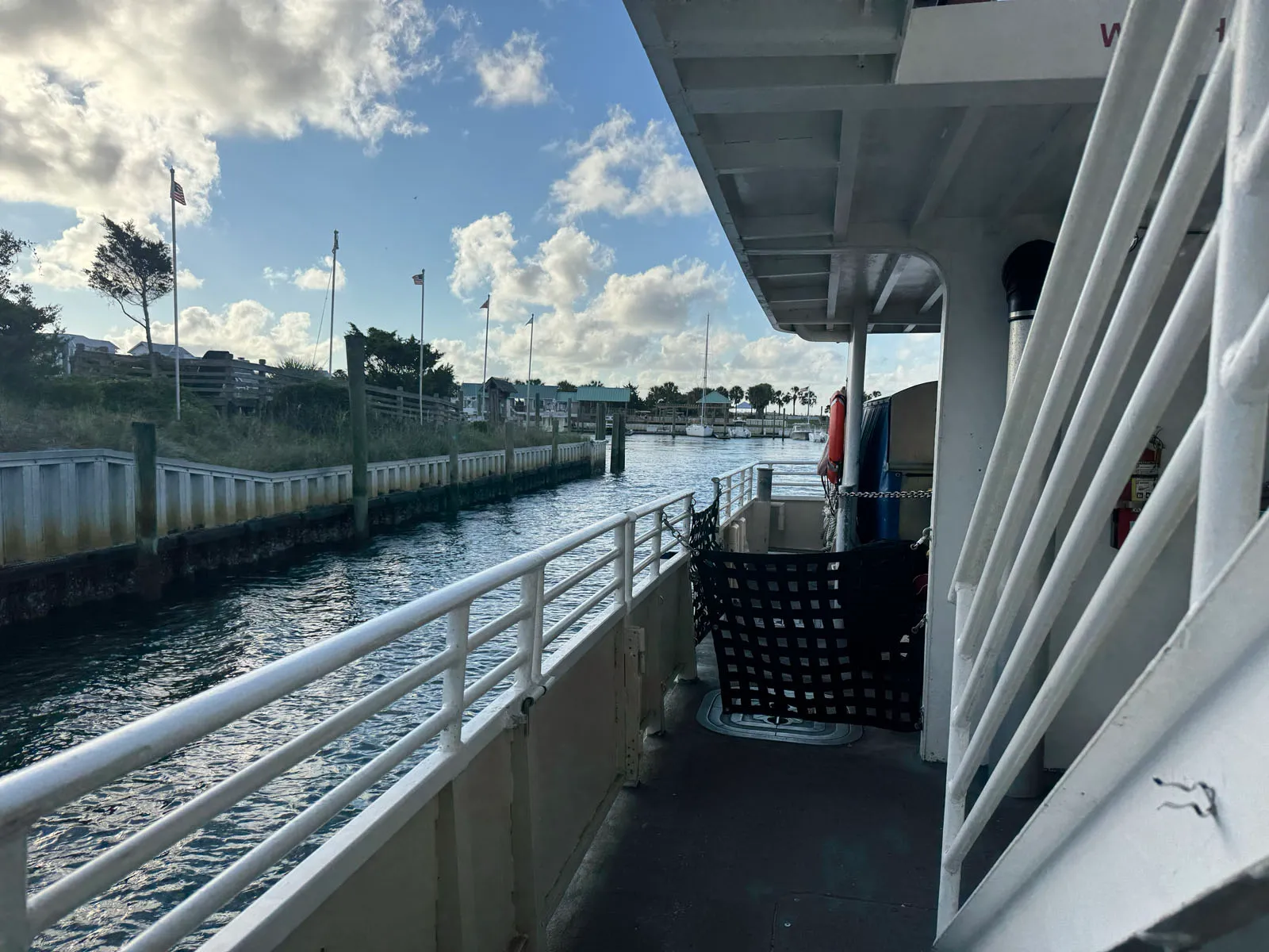 View from ferry deck departing marina channel