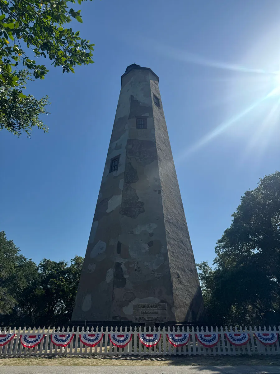 Old Baldy lighthouse full tower with sun burst upper right