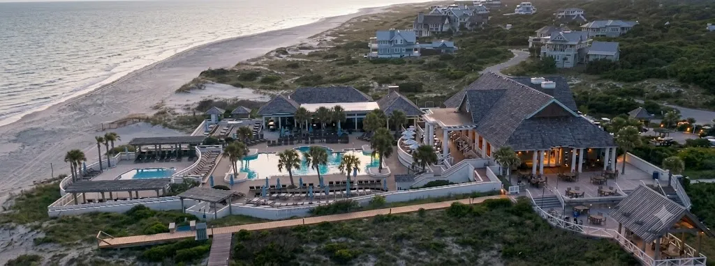 Aerial view of the Shoals Club pools and clubhouse beside the beach and ocean