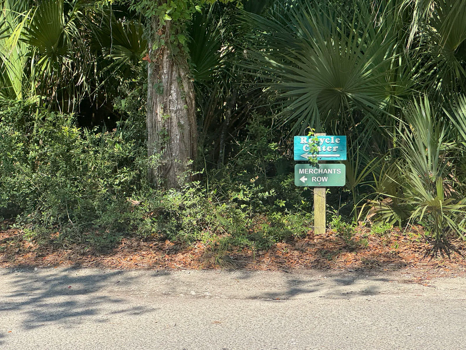 Green directional sign pointing to Merchants Row