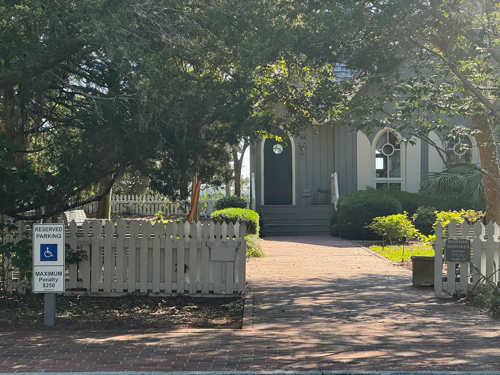 Village Chapel entrance with reserved parking sign